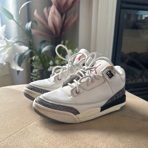 White and Black Sneakers with Red Accents